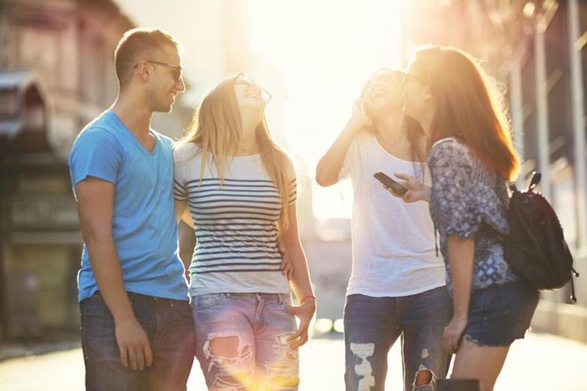 a group of young people walking down a street