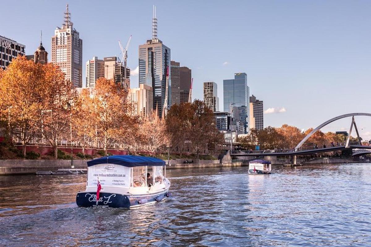 a boat on a river with a city in the background