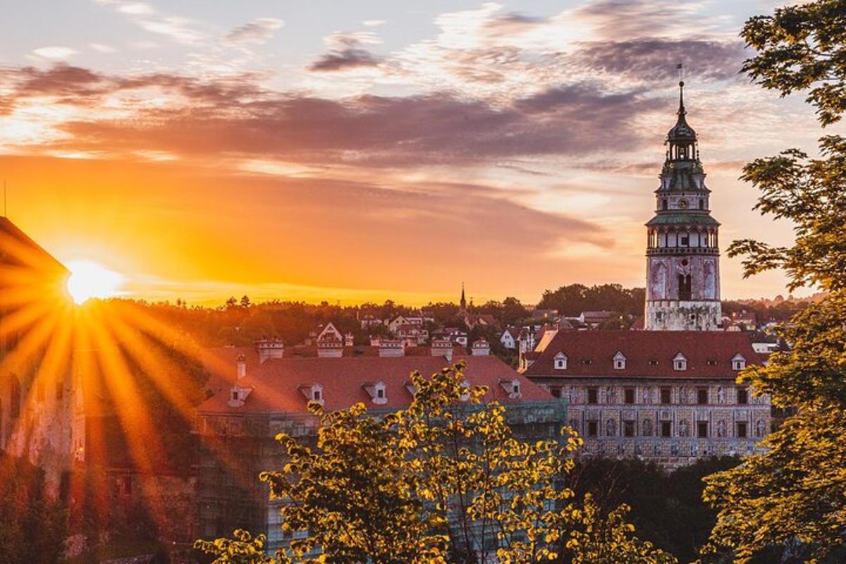a view of a building with a clock tower at sunset