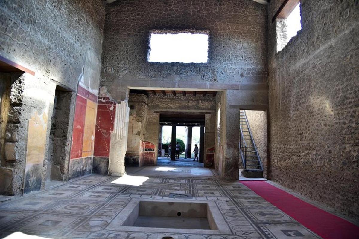 an empty room with a tile floor and a window
