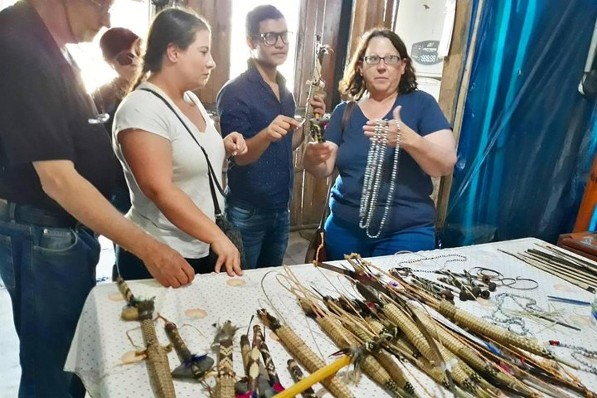 a group of people standing around a table with weapons