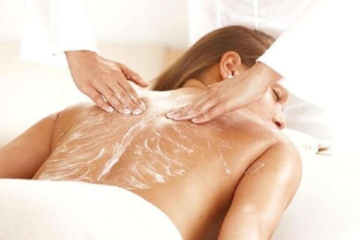 a woman getting a massage from a therapist