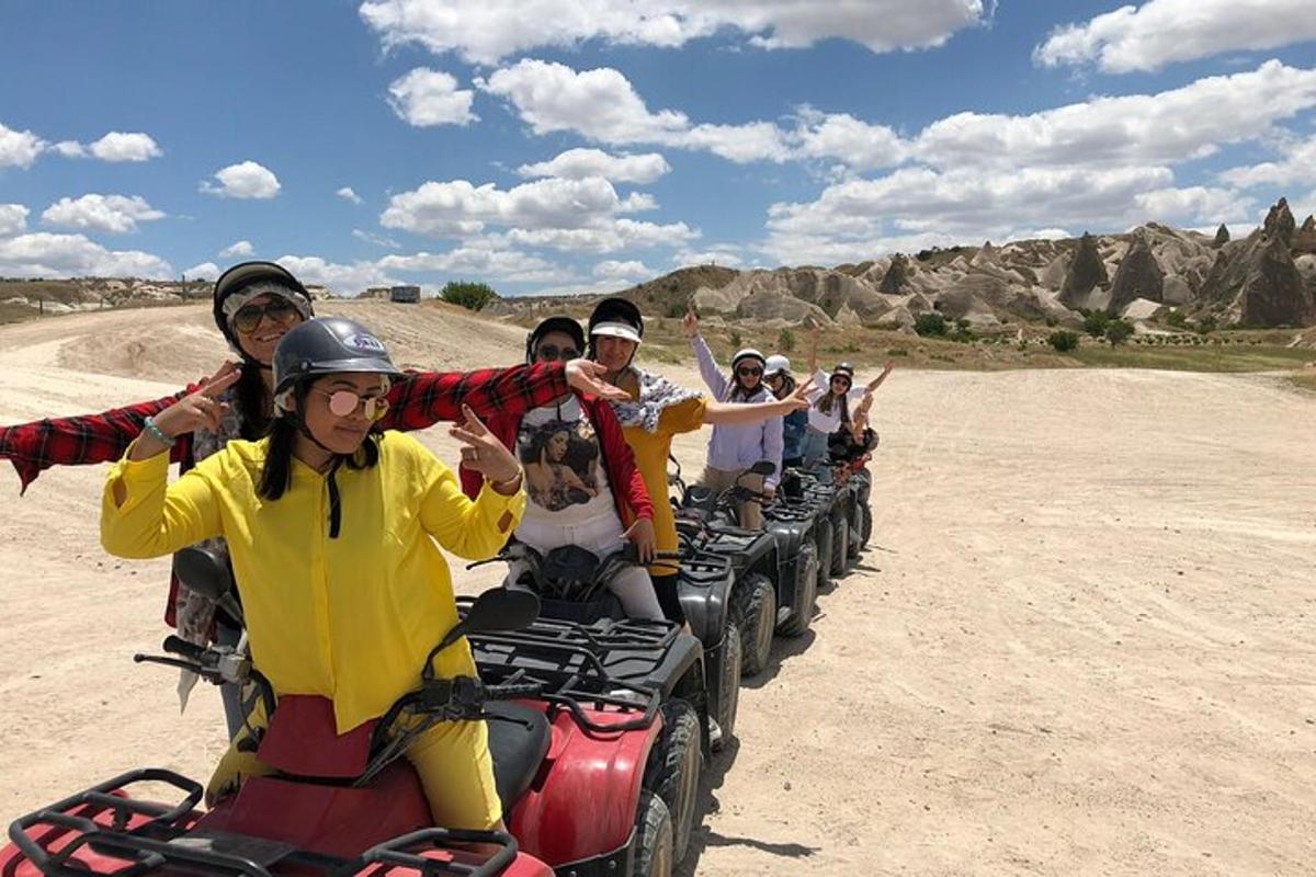 a group of people riding on atvs in the desert