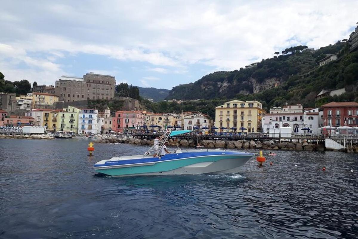 a blue and white boat in a body of water