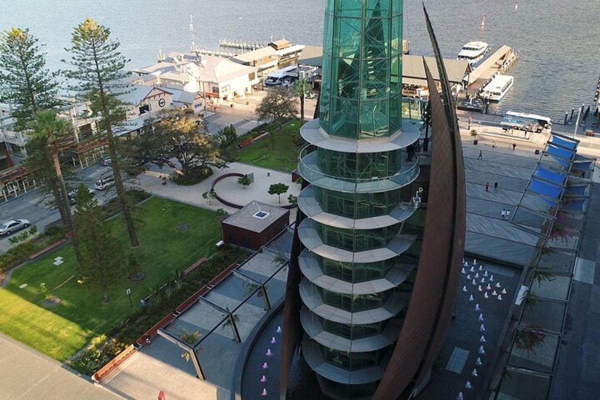 an aerial view of a building next to the water
