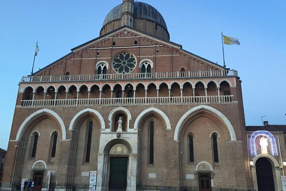 a large brick building with a dome on top