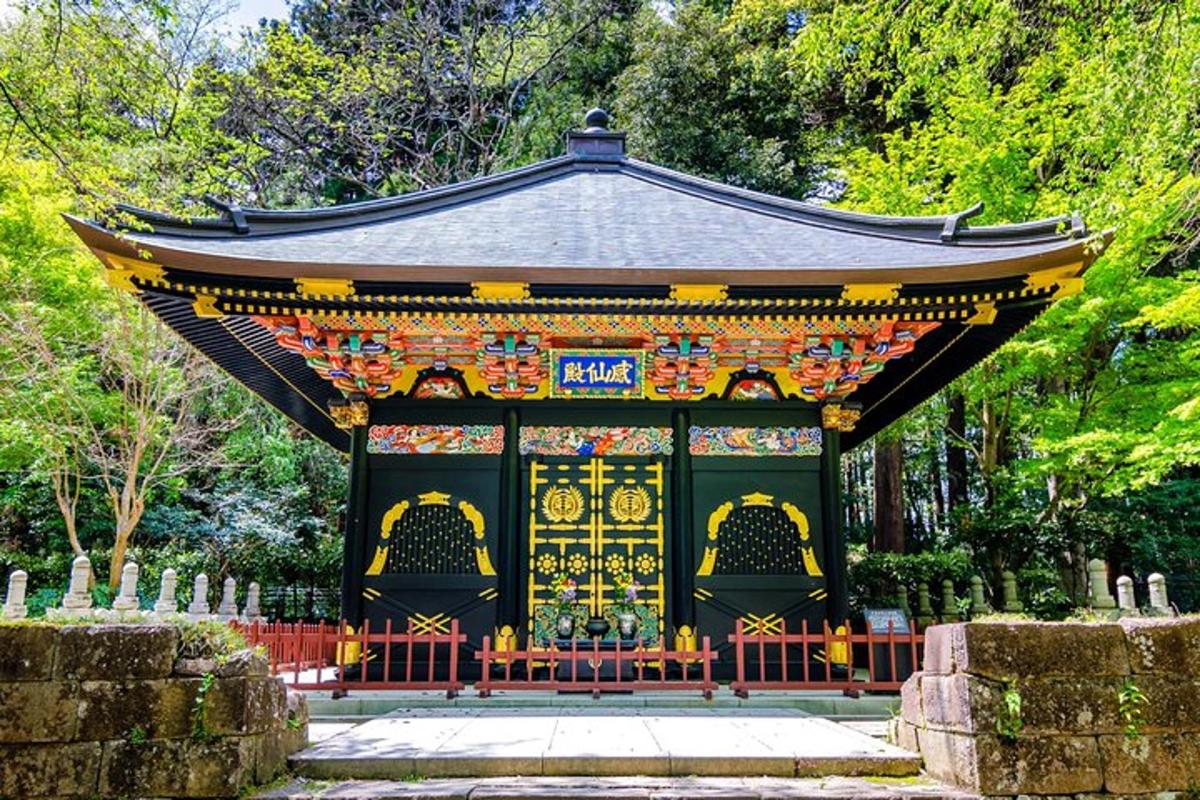 a shrine in a park with trees in the background