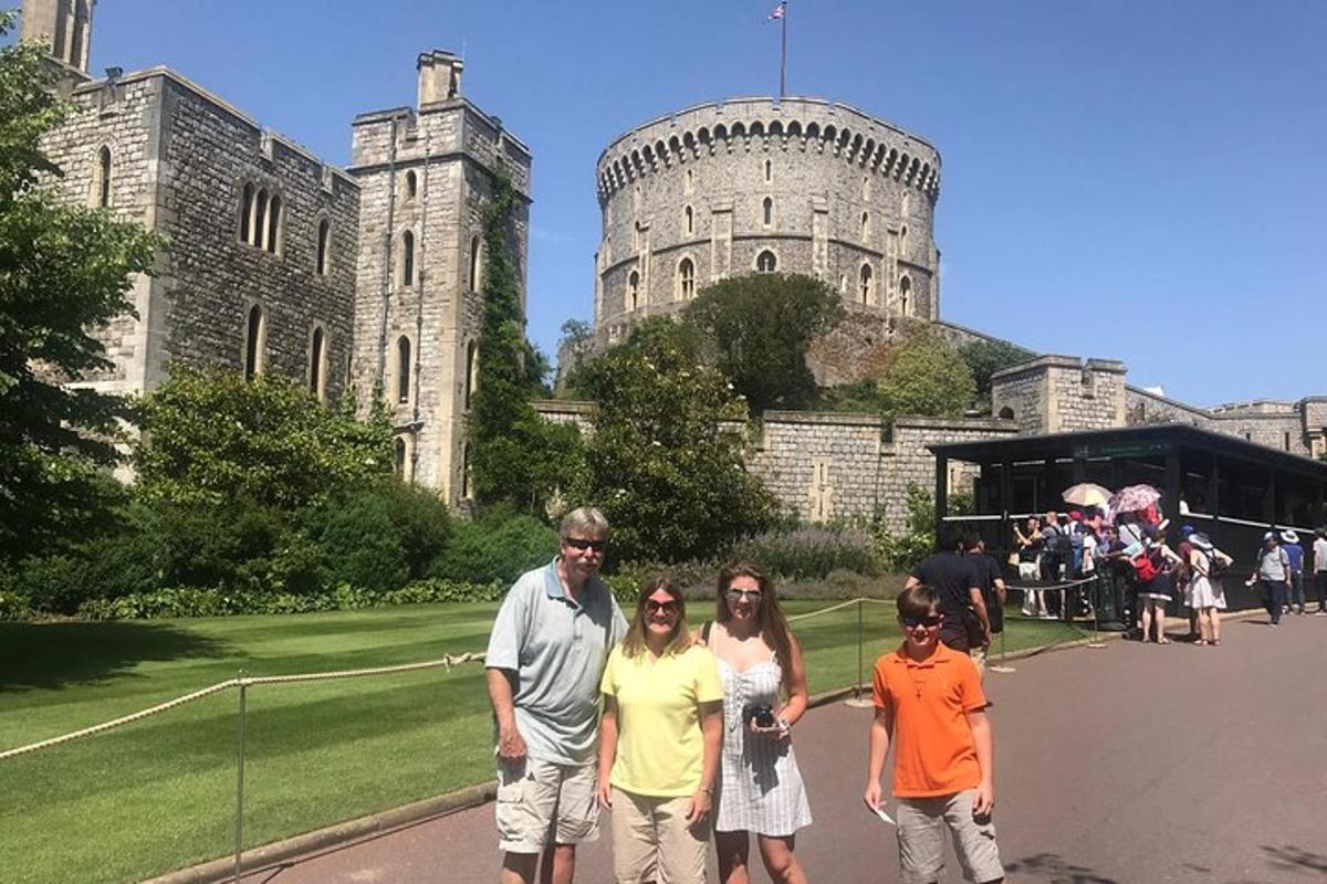 a group of people standing in front of a castle