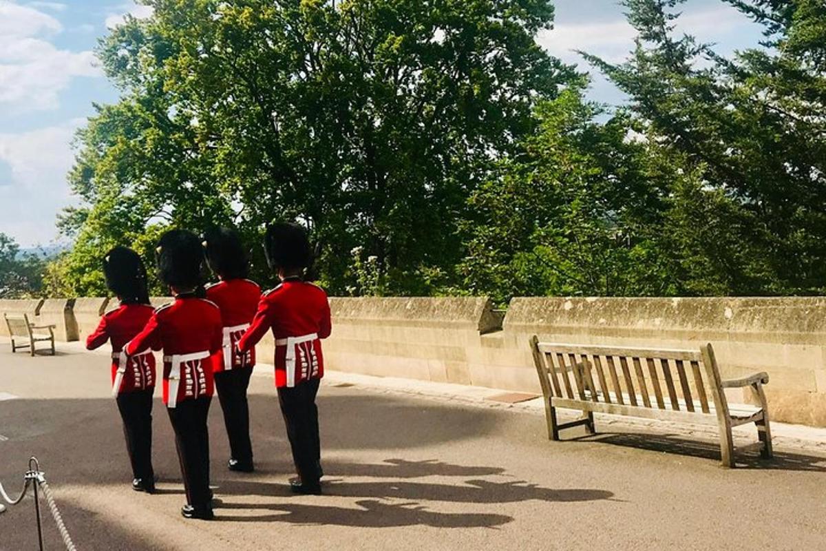 a group of people in uniform standing next to a bench