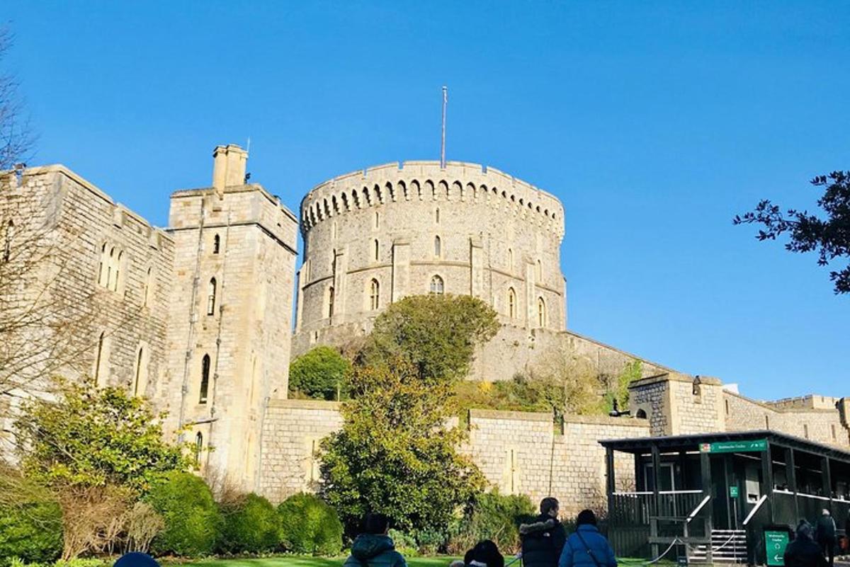 a castle with people sitting in front of it