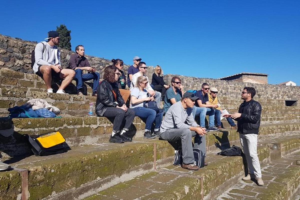 a group of people sitting on the steps