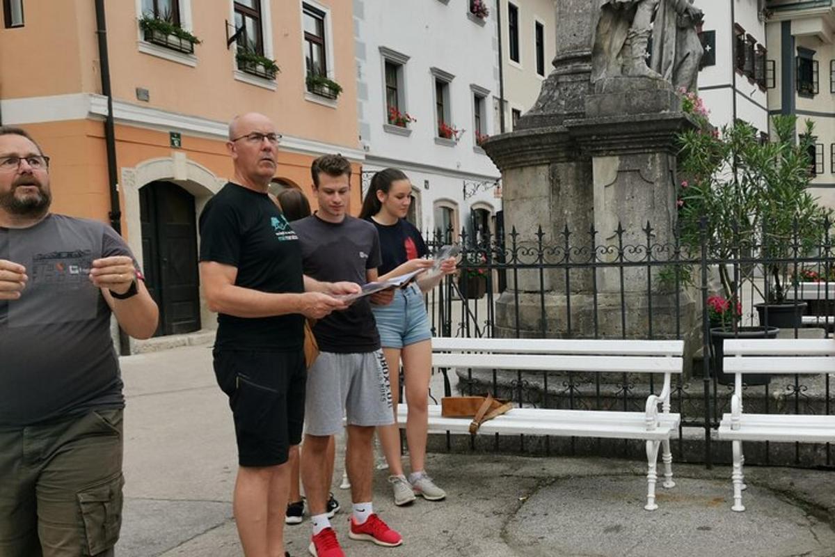 a group of people standing in front of a bench