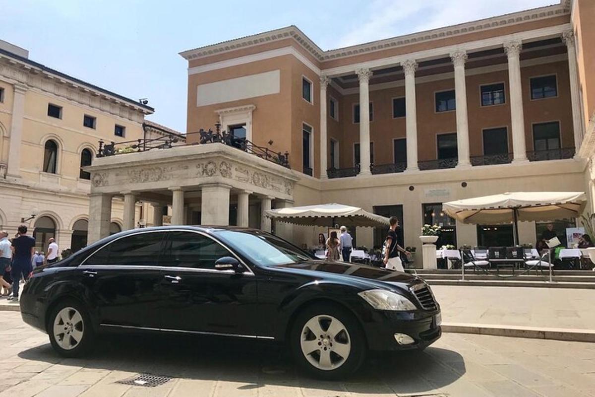 a black car parked in front of a building