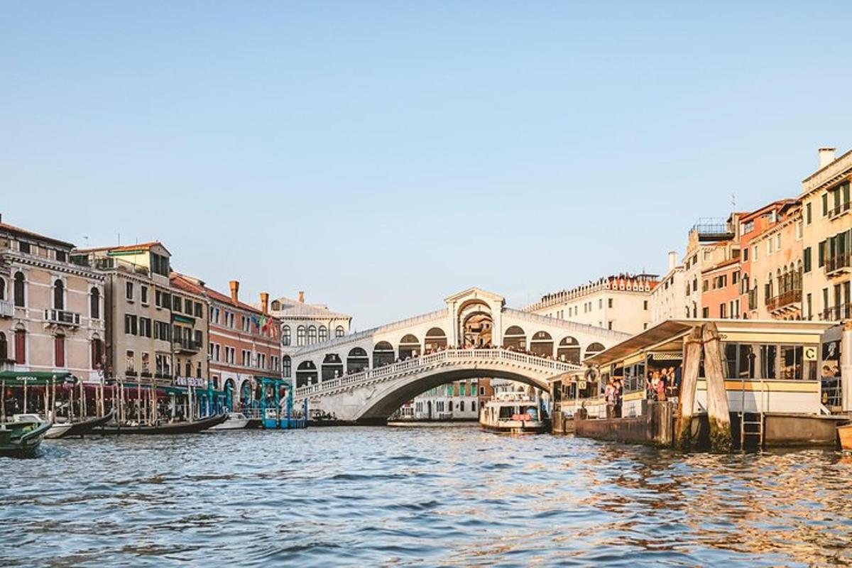 a view of a canal with a bridge and buildings