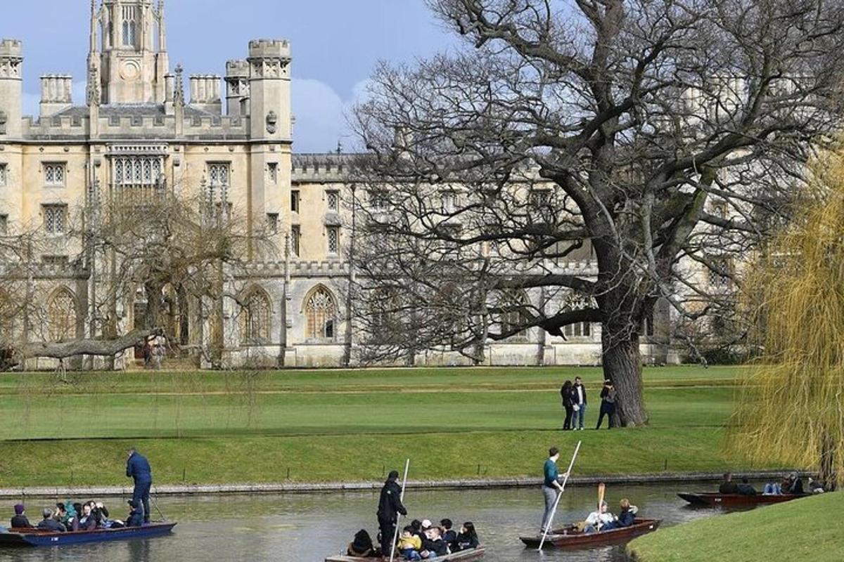 people in boats in the water in front of a castle