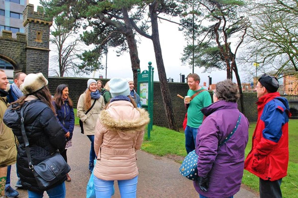 a group of people standing around in a park