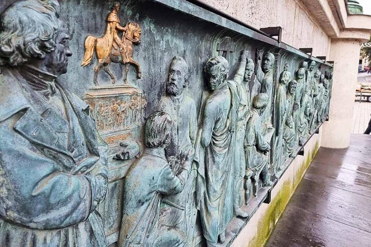 a wall with a bunch of statues on it