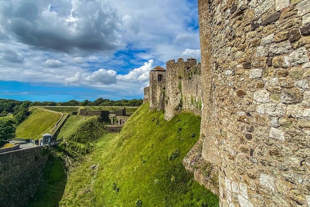 an old castle on top of a grassy hill