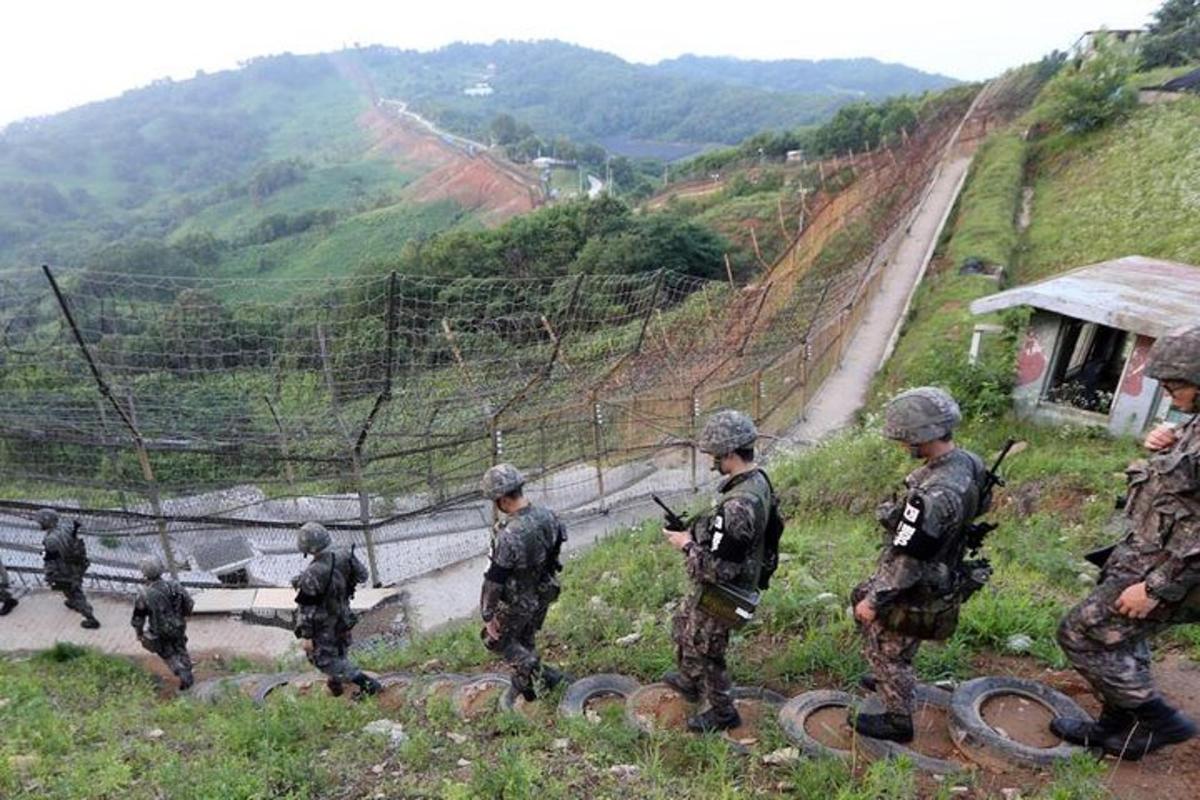 a group of soldiers walking down a hill