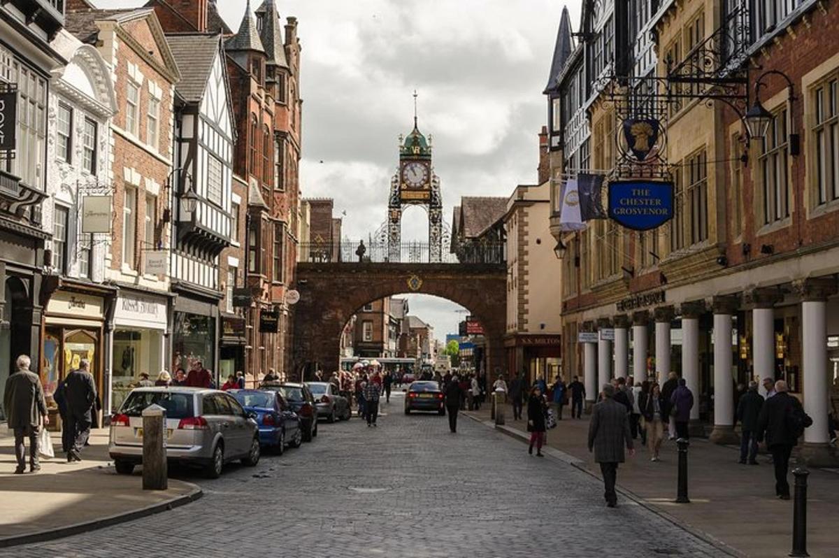 a city street with a clock tower in the distance