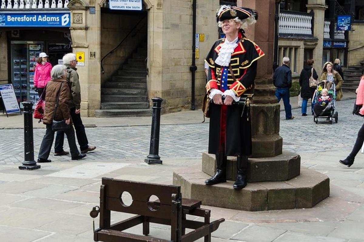 a statue of a man in uniform standing next to a bench