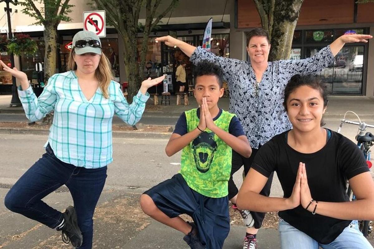 a group of people posing for a picture on a street