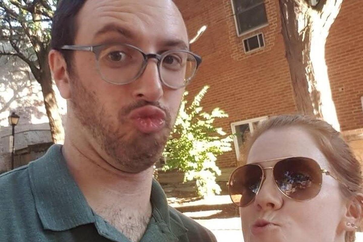 a man and a woman sticking their tongue