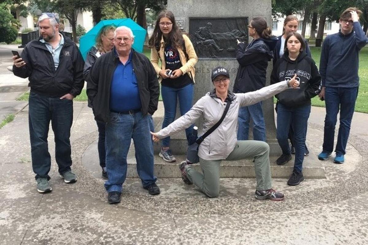 a group of people standing in front of a monument