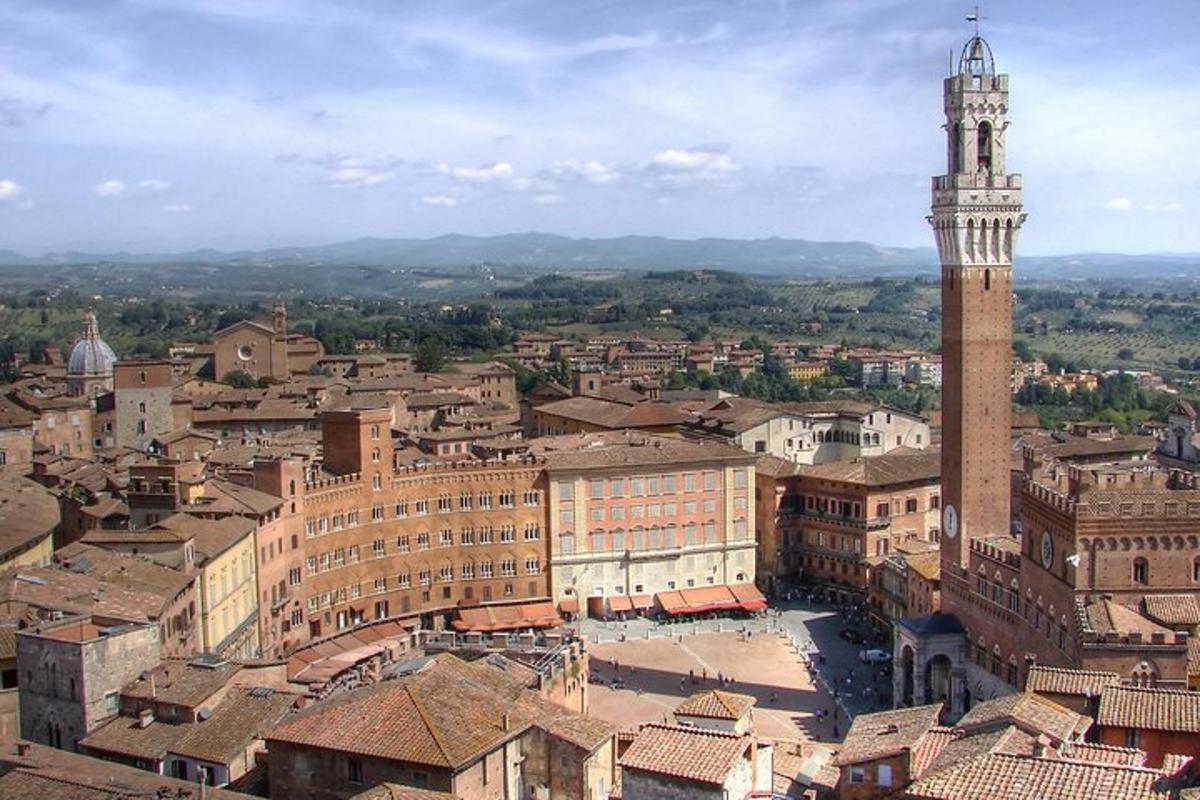 an aerial view of a city with a clock tower