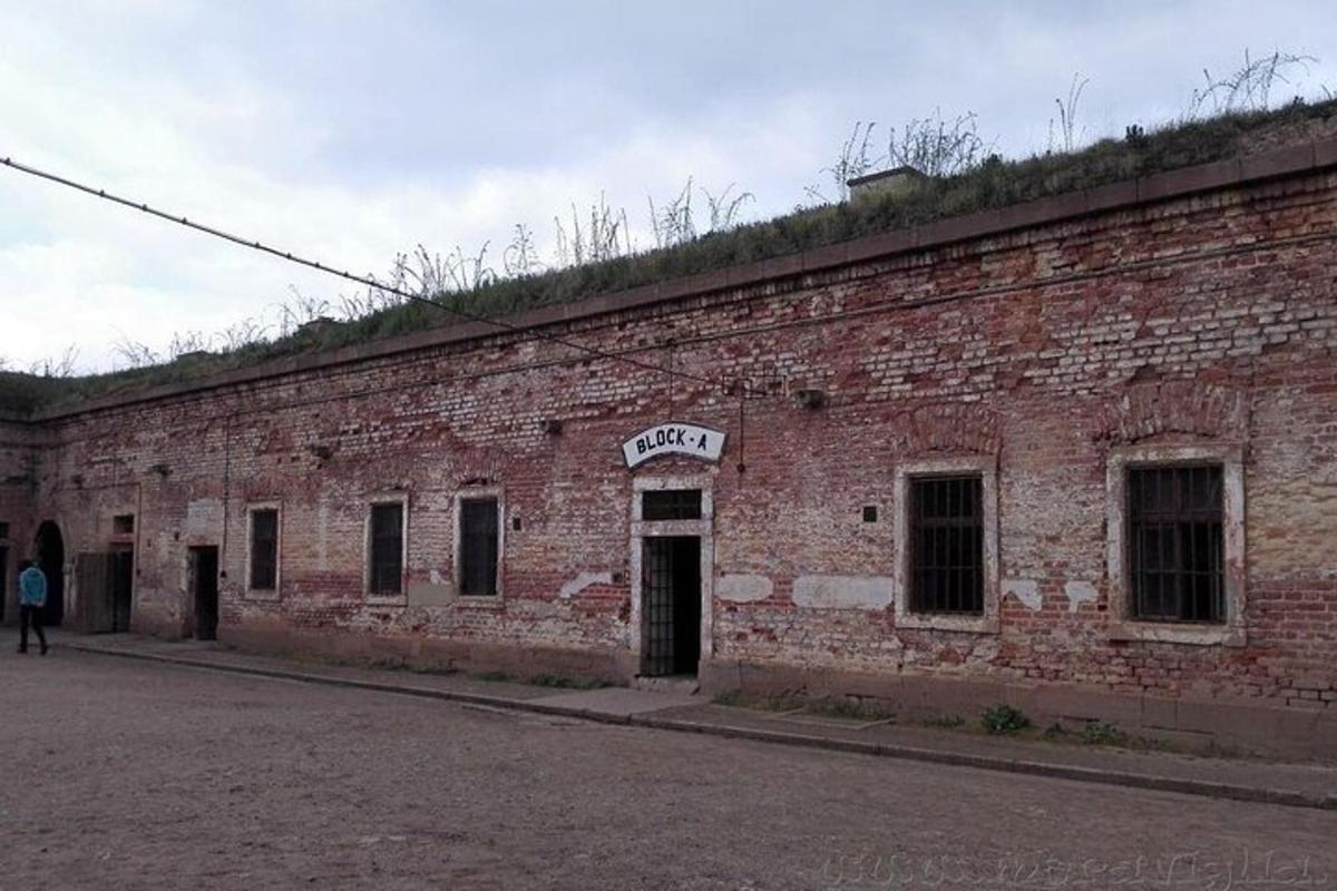 an old brick building with a sign on it