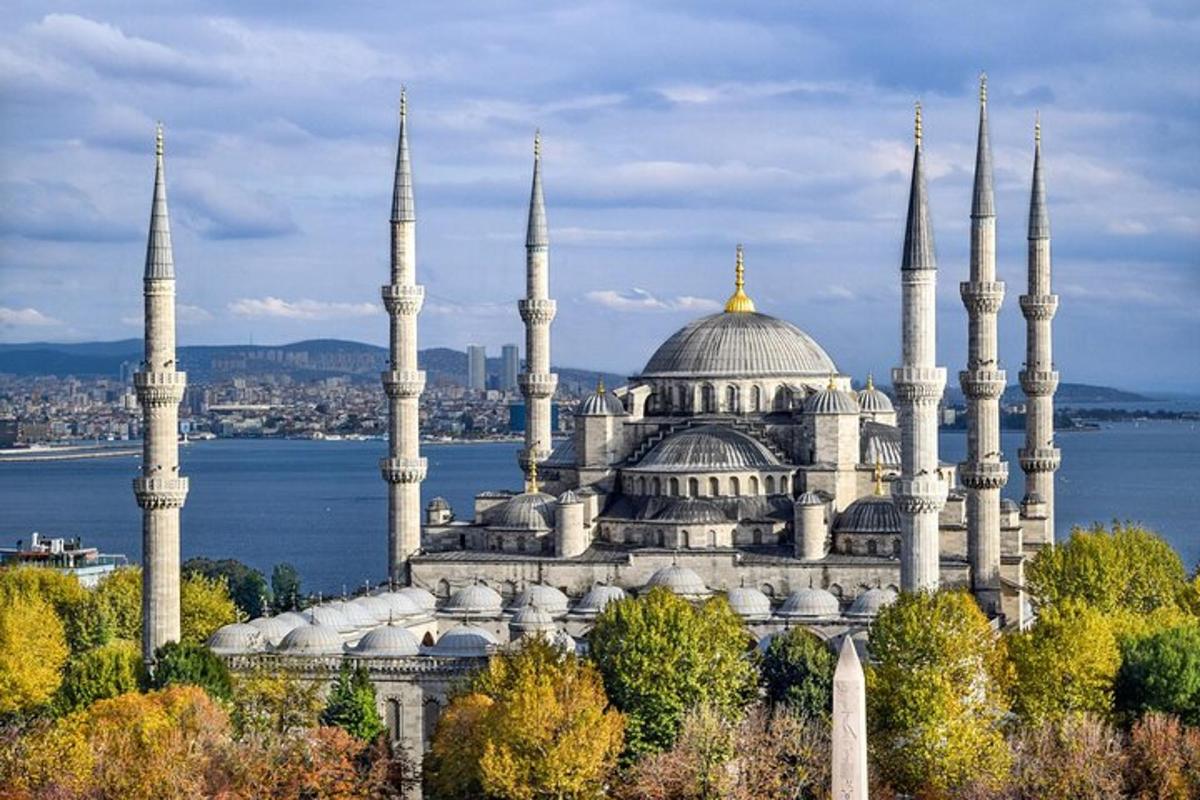 a large building with blue domes and mosques