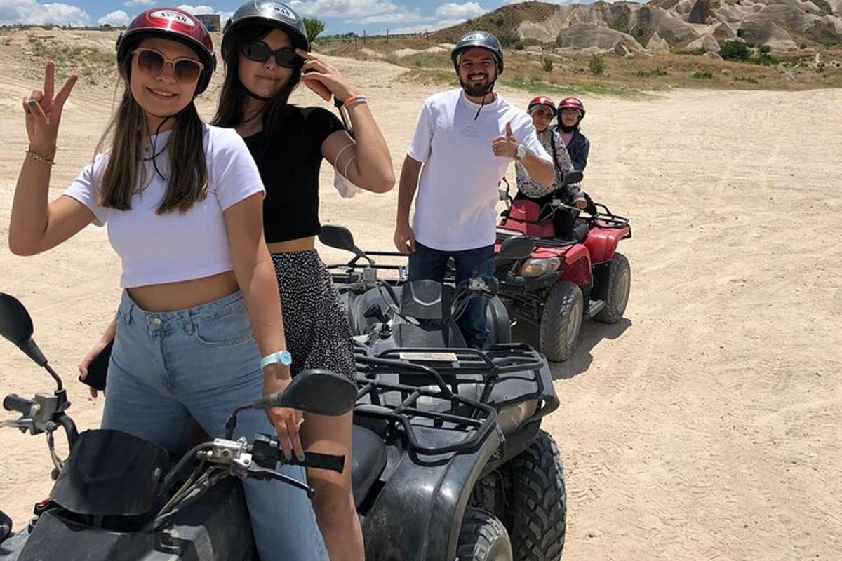 a group of people riding atvs in the desert