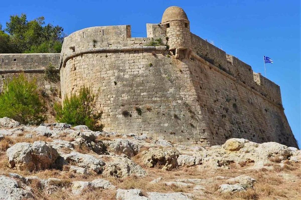 a large brick building sitting on top of a hill