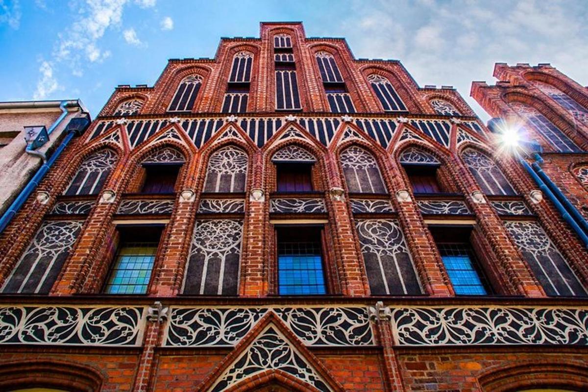 a tall red brick building with many windows