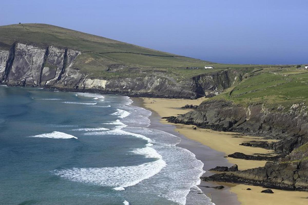 an aerial view of a beach with rocks and the ocean