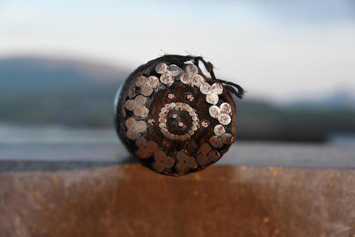 a close up of a rock with diamonds on it
