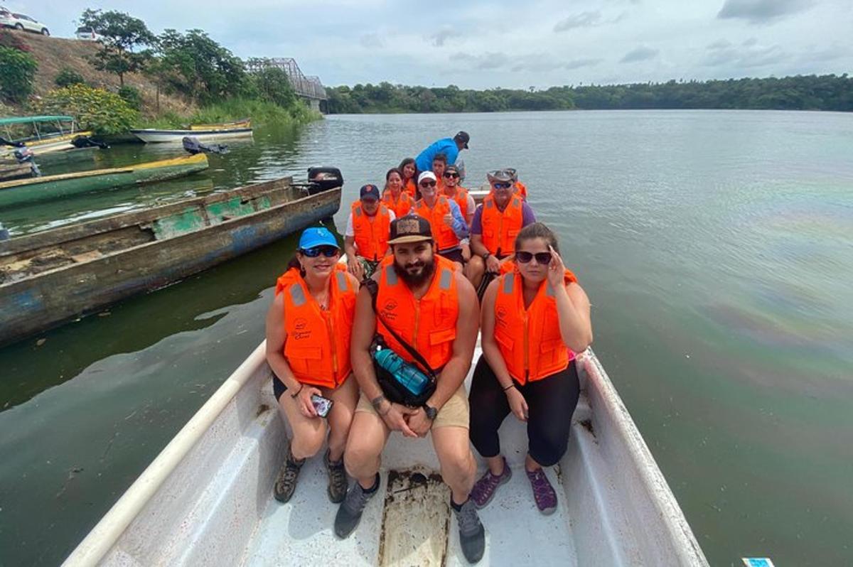 a group of people on a boat on the water