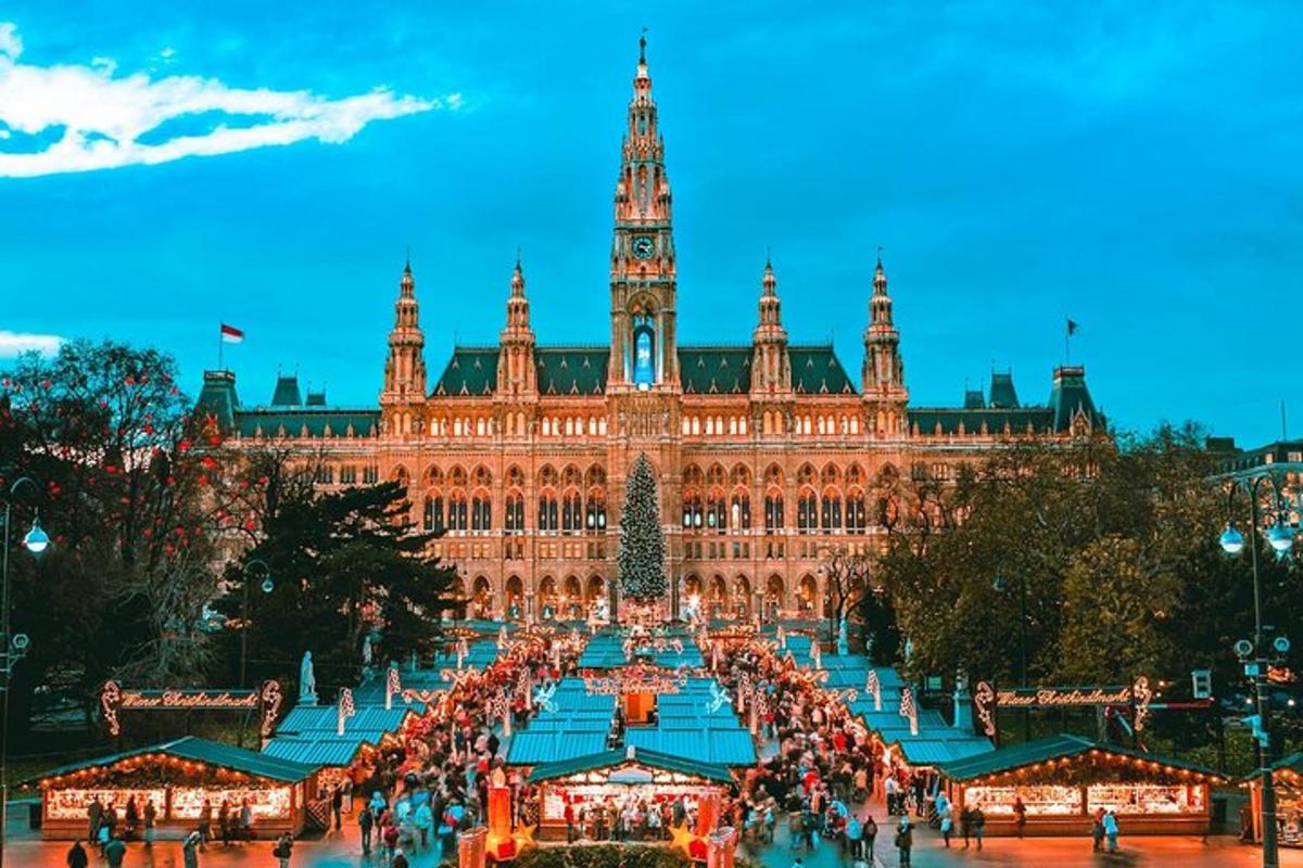 a large building with a christmas market in front of it