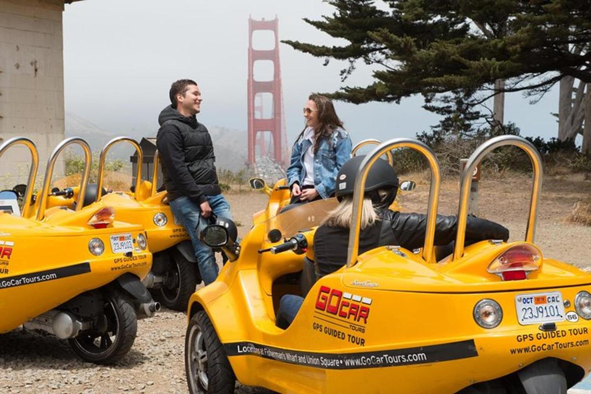 a man and a woman riding on motorcycles with a car