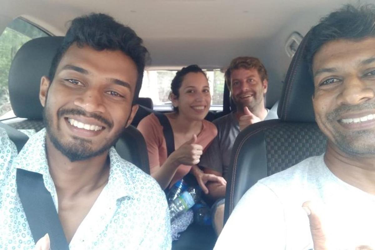 a group of people sitting in the back of a car
