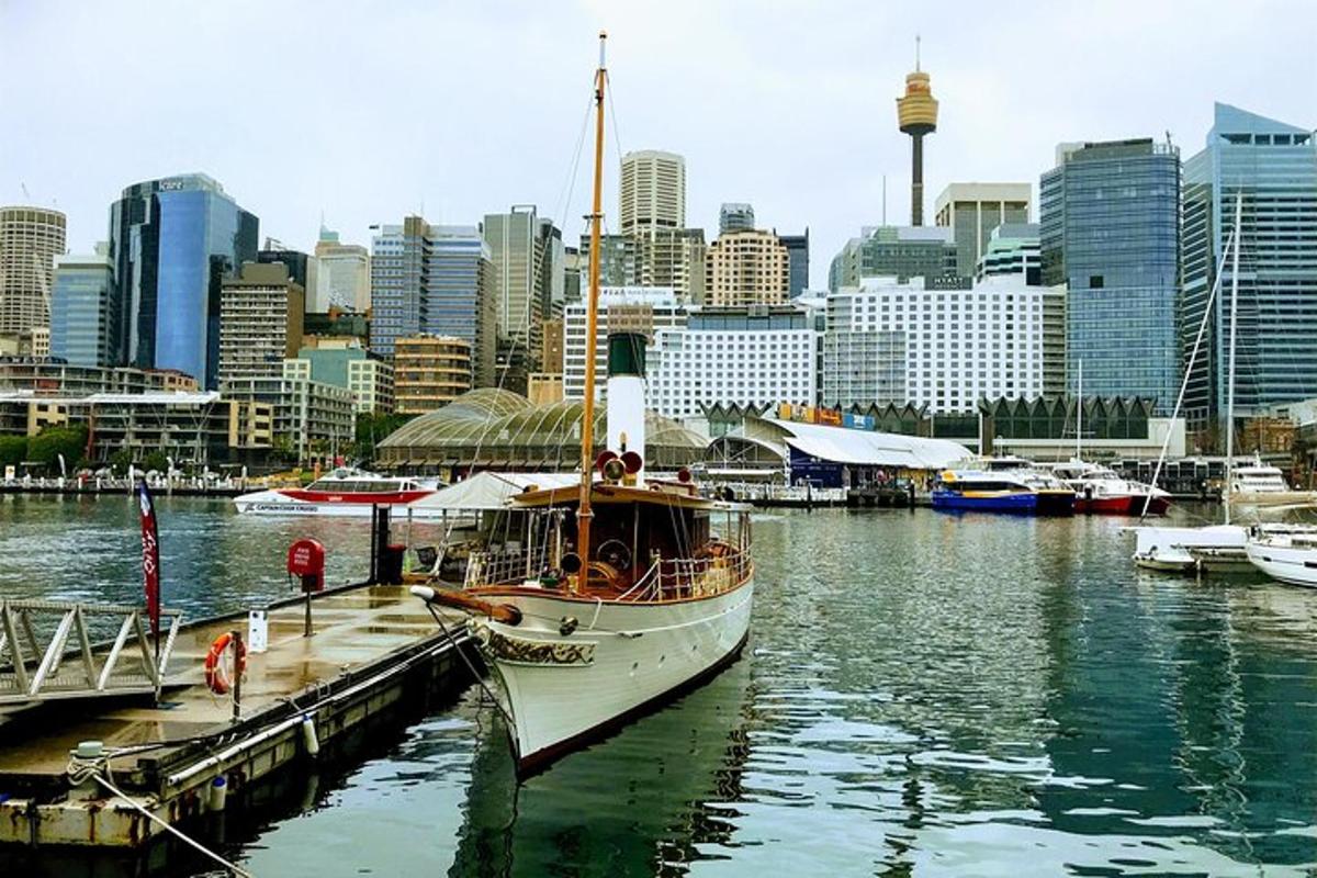 a boat is docked at a dock in a city