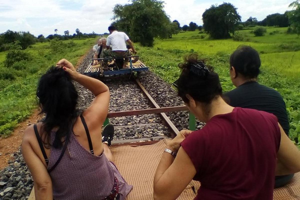 a group of people looking at a train
