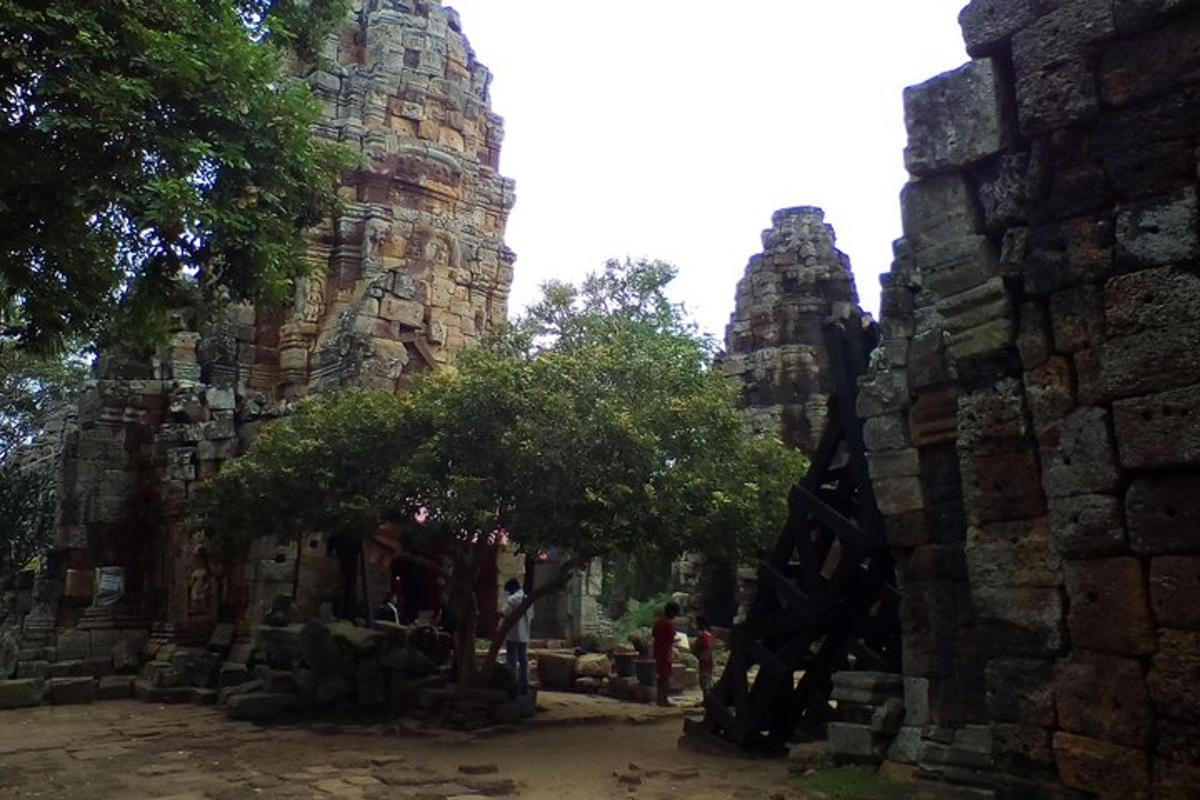 a stone building with trees in front of it