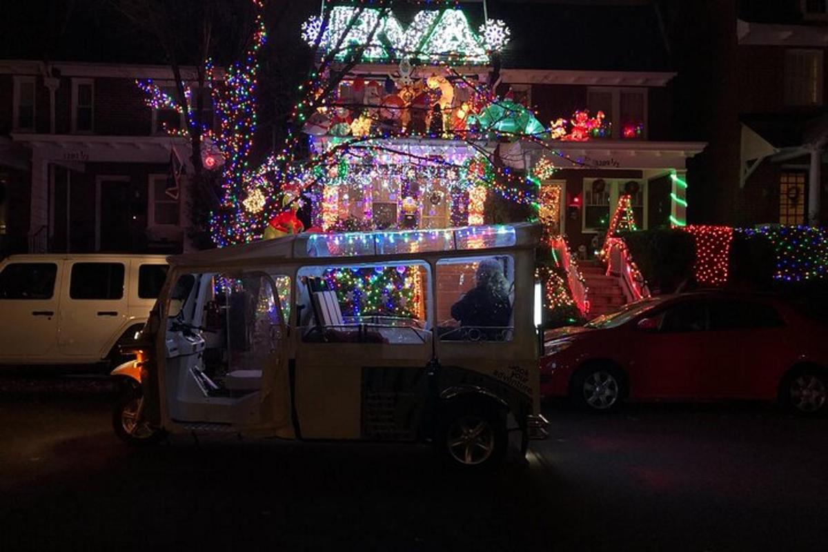 a food cart is decorated with christmas lights