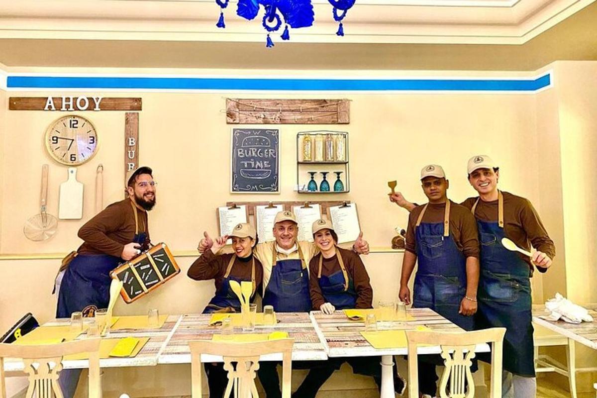 a group of people standing around a table