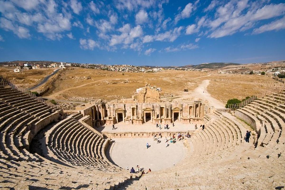 an amphitheater with people standing in the stands