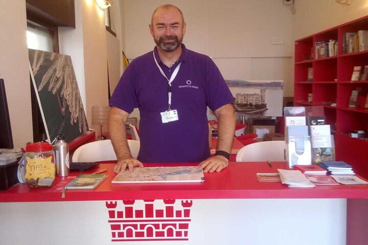 a man standing at a counter in a store