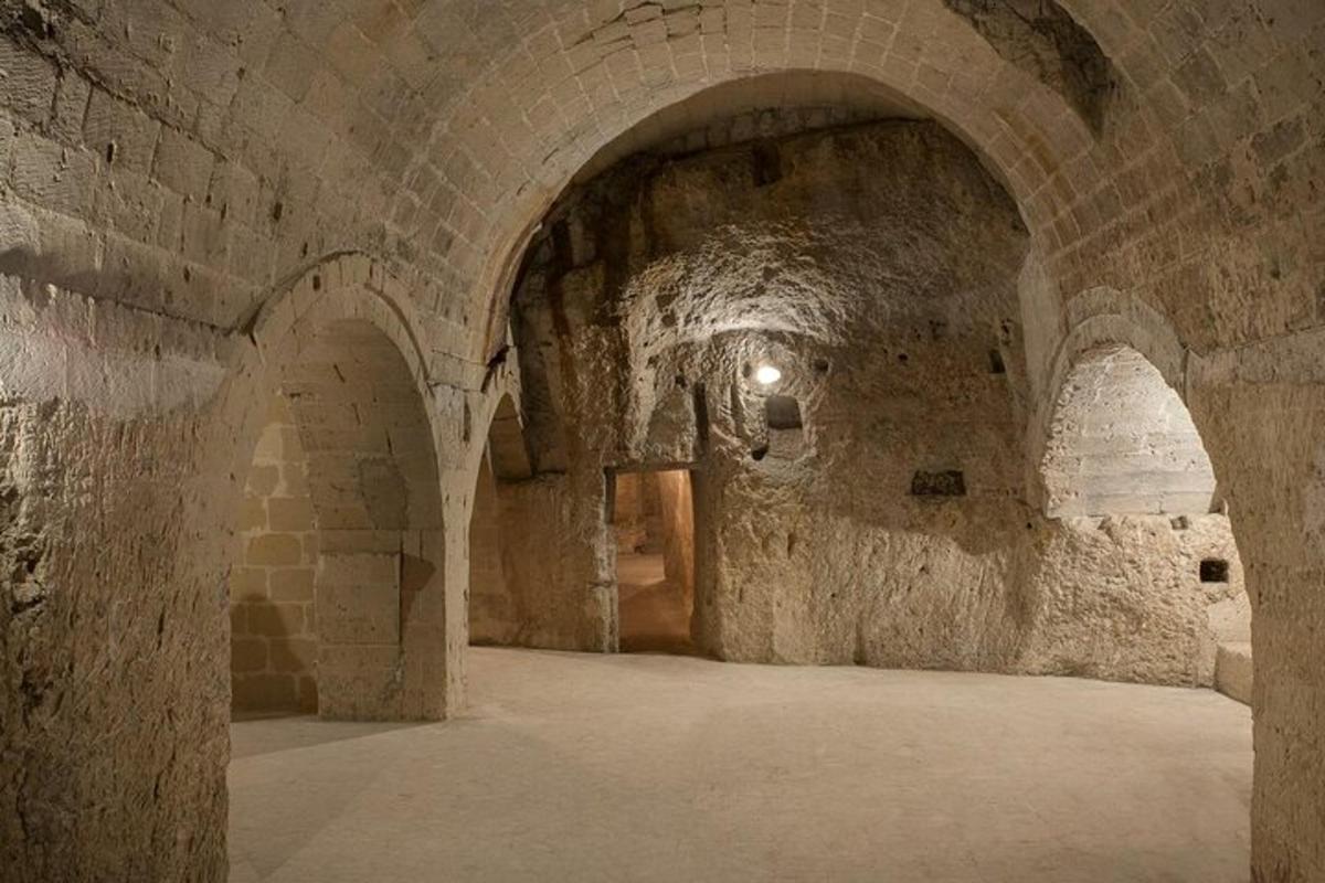 an old stone hallway with arches in a building