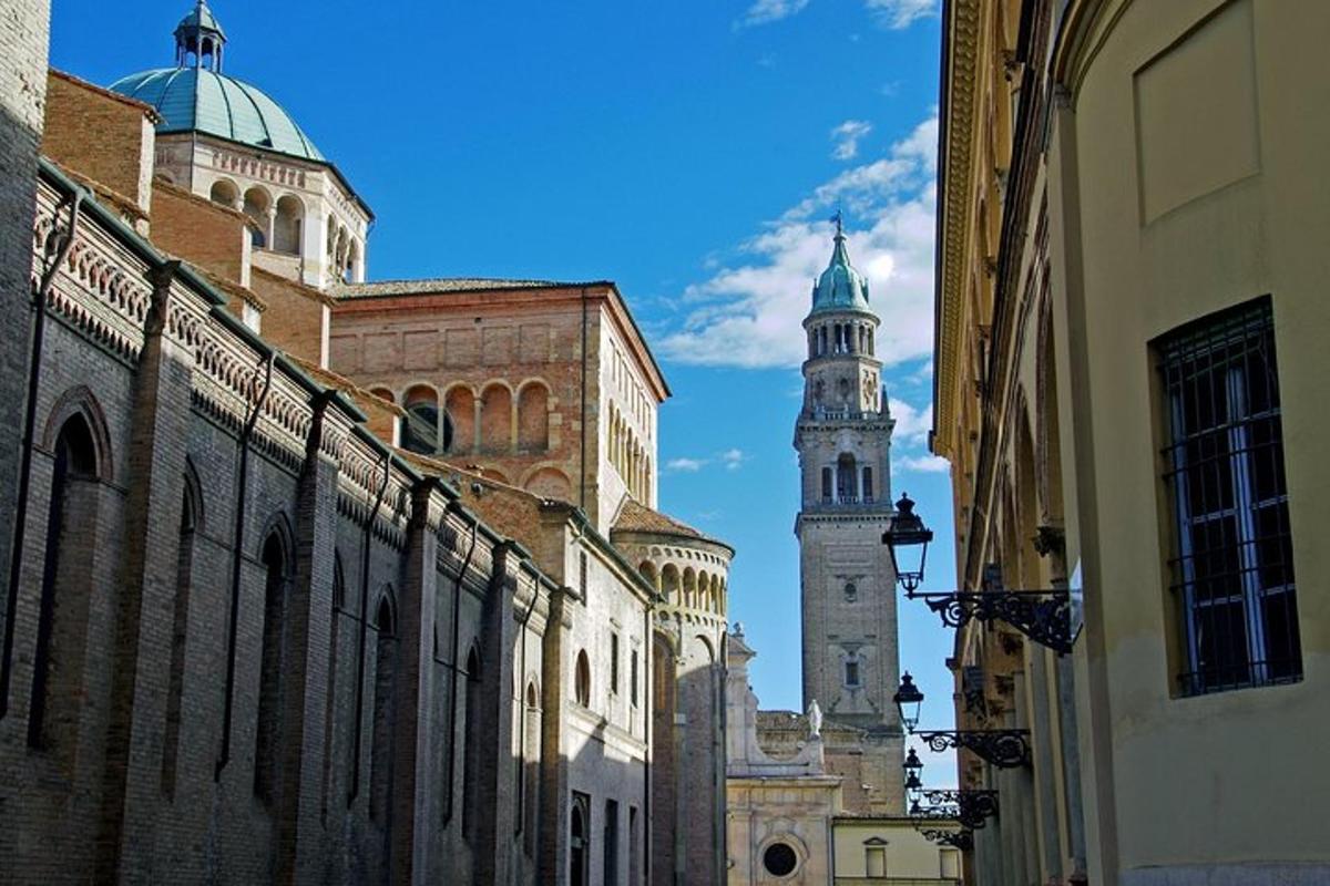 a street with two tall buildings and a clock tower