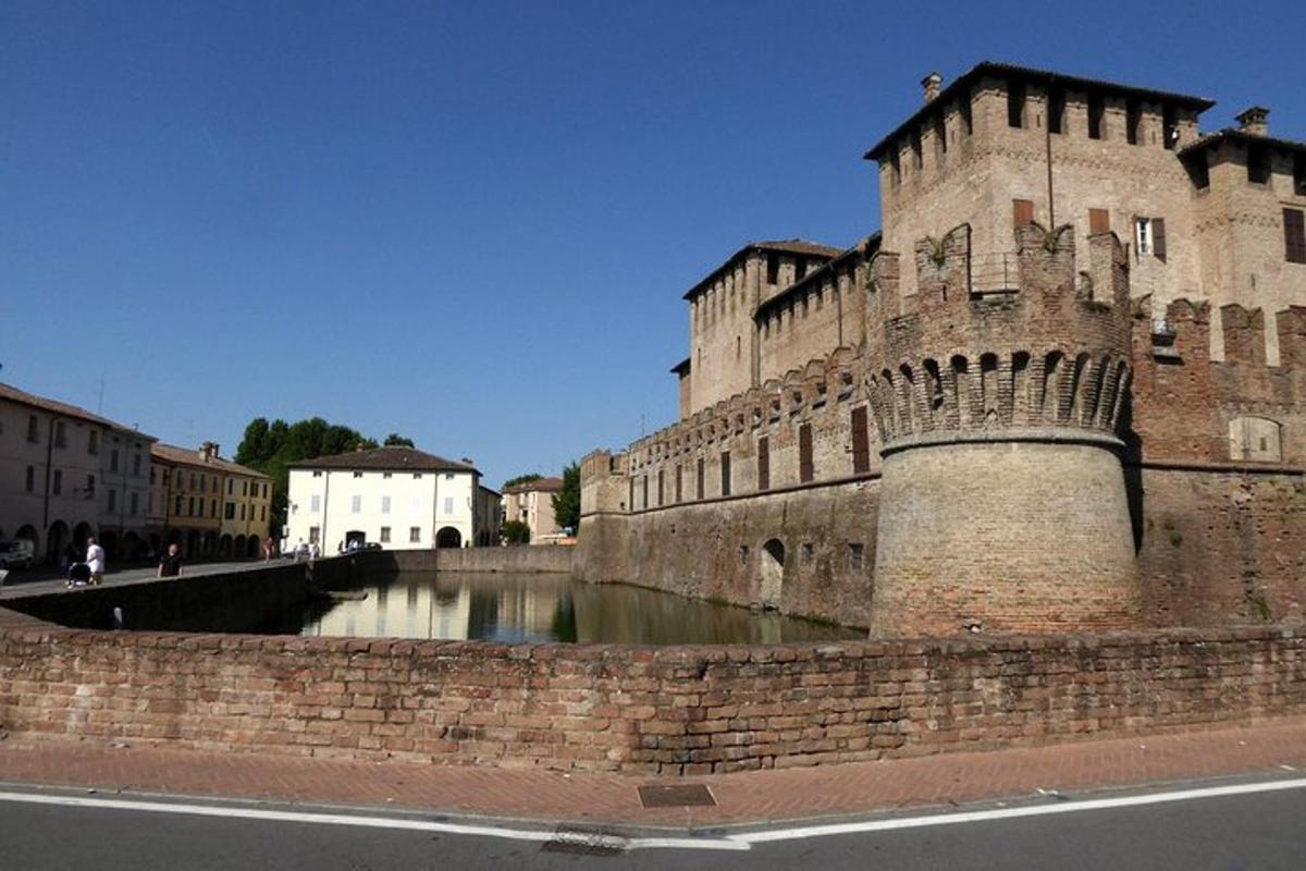 an old castle with a river in front of it